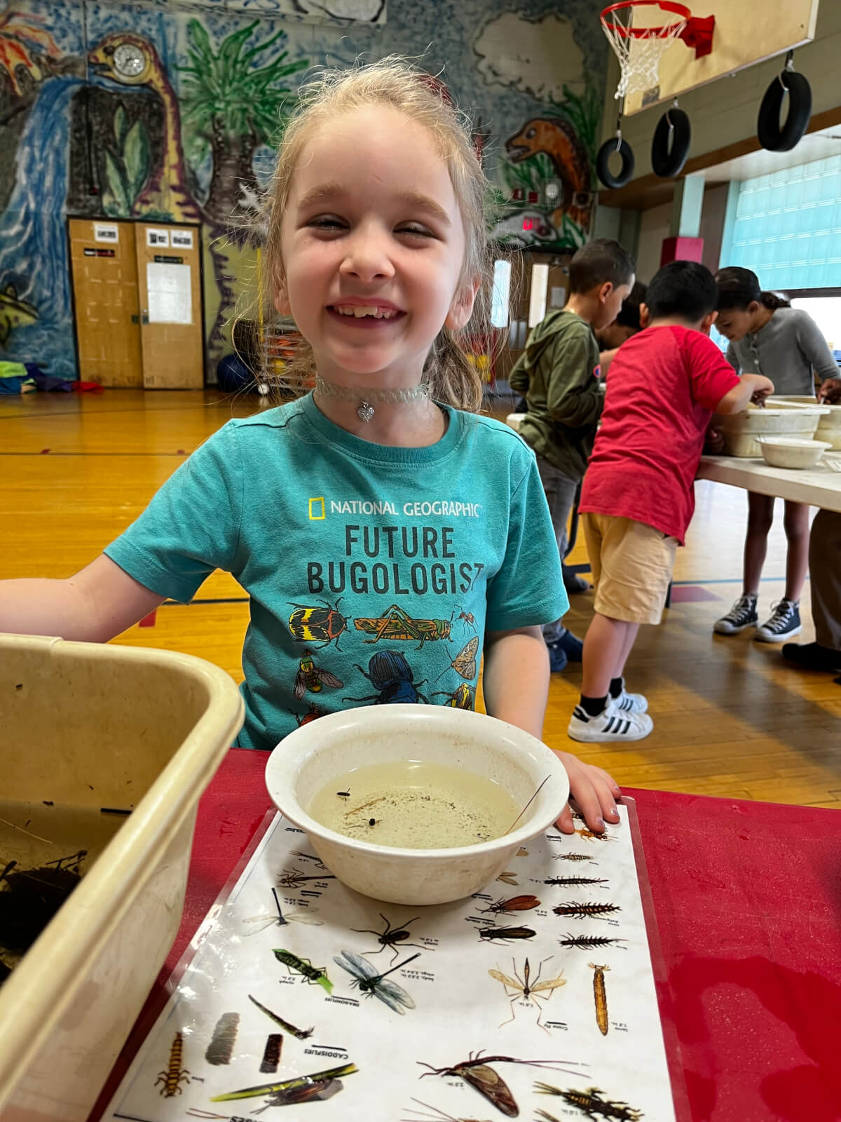 Young Girl Smiling Over Science Project